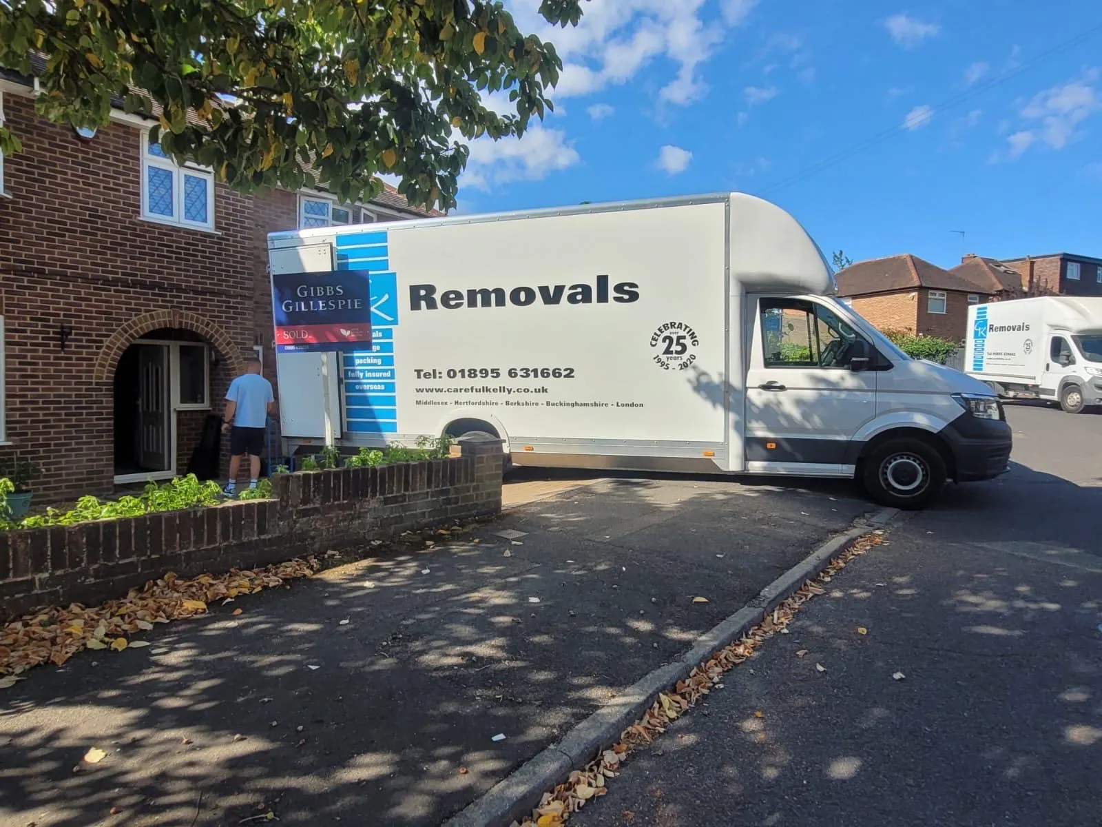 Careful Kelly Removals van outside a recently sold home, ready to begin a domestic move