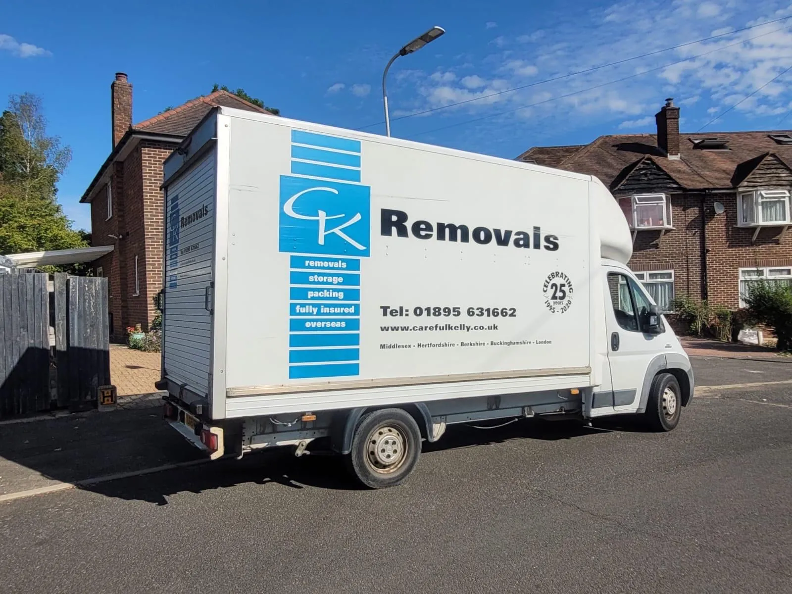 Careful Kelly Removals van on a quiet residential street