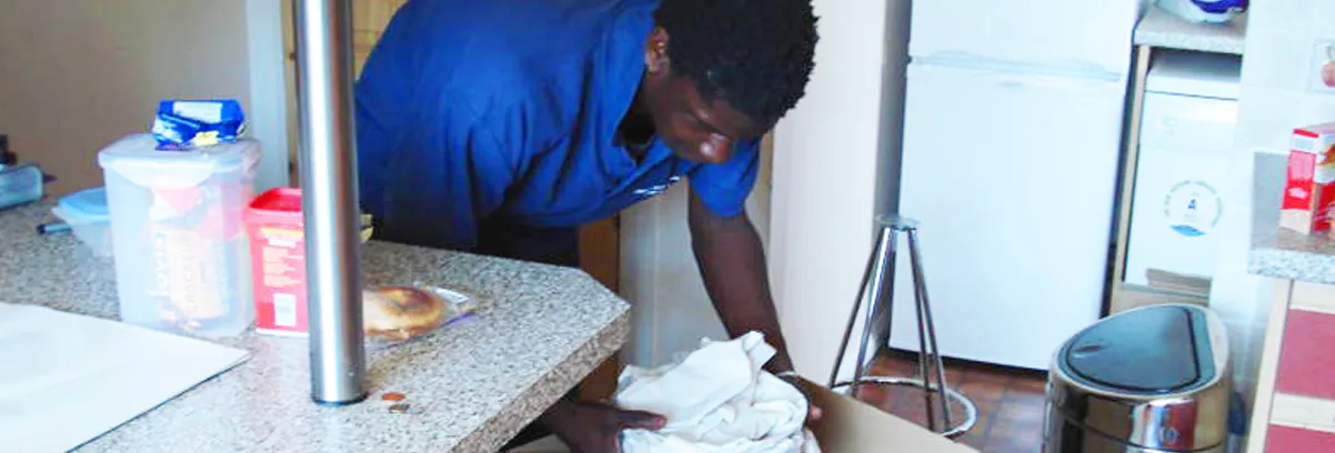 Careful Kelly Removals crew carefully wrapping fragile items during a packing service